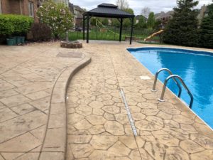 Stamped Concrete Pool Deck Before Sealing in Macomb Twp.