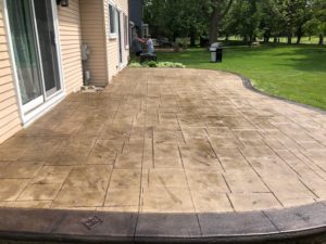 Stamped Concrete Patio after Stripping , Border stained and application of sealer, Troy, Mi.