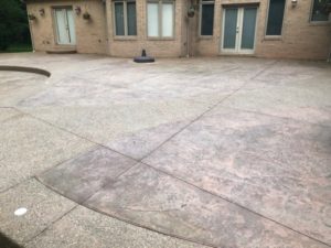 Stamped Concrete Patio in Clinton Twp., Before Stamped Concrete Sealer stripping using wet abrasive blaster to remove sealer
