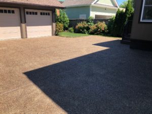 Royal Oak Exposed aggregate Driveway After Wash and Seal with a brown tone sealer